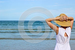Woman In White Dress Looking At Ocean