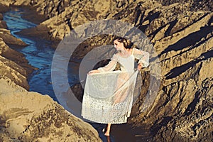 Woman in white dress pose in water, fashion