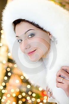 Woman in white fur hood