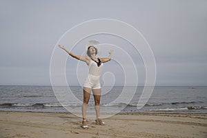 Woman in a white hat on background of the sea