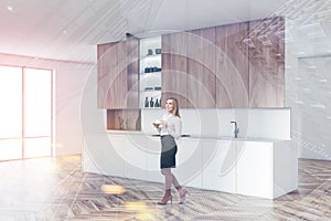 Woman in white kitchen corner with countertops