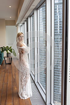 Woman in white lace negligee