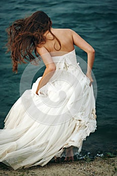 Woman in White near Stormy Sea