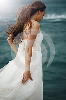 Woman in White near Stormy Sea