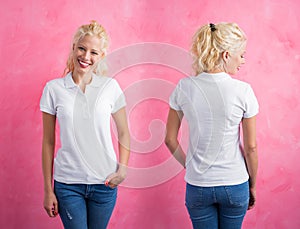 Woman in white polo T-shirt on pink background