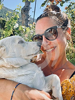 Woman and white puppy