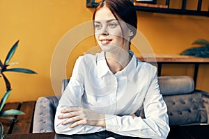 woman in white shirt in restaurant front view