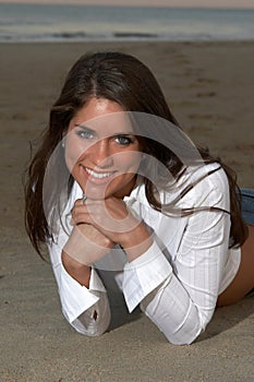 Woman in White Tailored Top Lying on Stomach photo