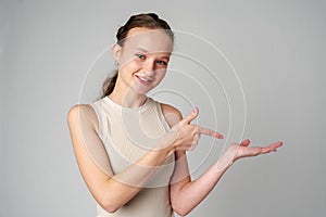 Woman in White Top Pointing at Something
