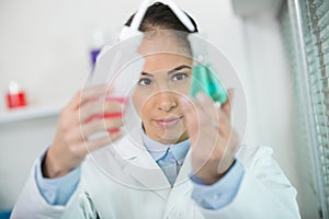 woman in white uniform in laboratory work on analize photo