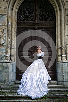 Woman in white Victorian dress