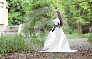 Woman in white Victorian dress