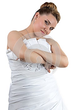 Woman in white wedding dress with arms crossed