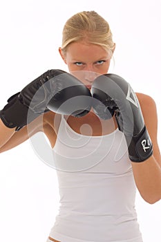 Woman who does kick boxing with boxing gloves