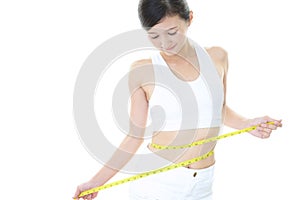 Woman who is measuring her waist