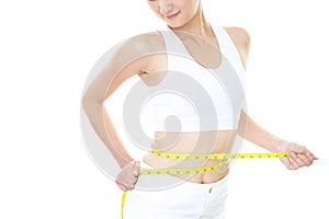 Woman who is measuring her waist