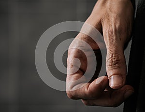 Woman who is nervously scratching a hangnail. photo