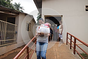 A woman who received a basic food kit donation