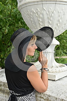 Woman in wide-brimmed hat and dress  portrait