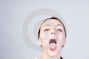 Woman with Wide Open Mouth Looking at Camera