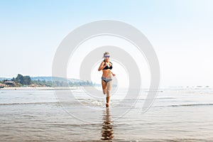 Woman on wide sandy beach