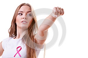 Woman wih pink ribbon on chest punching boxing