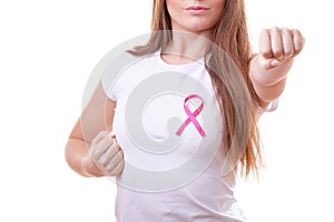 Woman wih pink ribbon on chest punching boxing