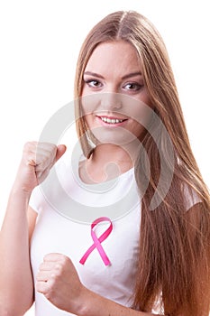 Woman wih pink ribbon on chest punching boxing