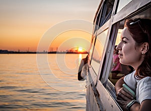 Woman in the window of pleasure boat