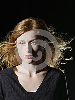 Woman With Windswept Hair Looking Away