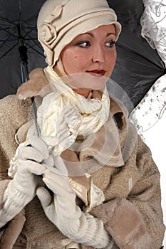 Woman in winter fur with umbrella