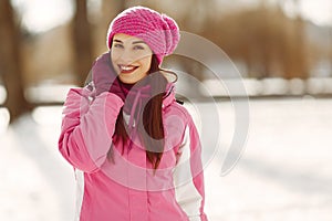 Woman in winter sports clothes looking at camera