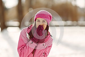 Woman in winter sports clothes looking at camera