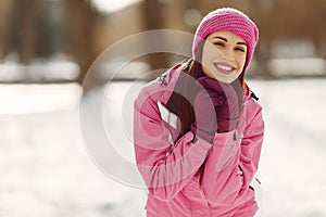 Woman in winter sports clothes looking at camera