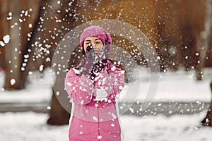 Woman in winter sports clothes looking at camera