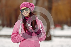 Woman in winter sports clothes looking at camera