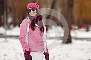 Woman in winter sports clothes looking at camera