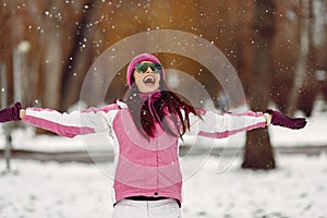 Woman in winter sports clothes looking at camera