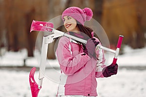 Woman in winter sports clothes looking at camera