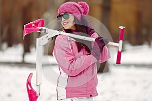 Woman in winter sports clothes looking at camera