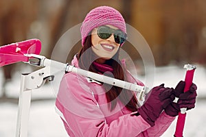 Woman in winter sports clothes looking at camera