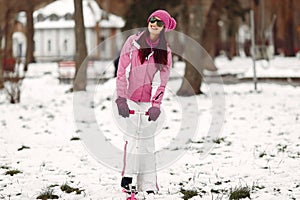 Woman in winter sports clothes looking at camera