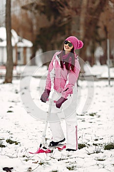 Woman in winter sports clothes looking at camera