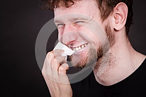Woman wipe man face by hygienic tissue.