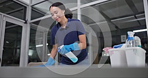 Woman, wipe and spray for cleaning in office, disinfection and janitor for liquid soap. Female person, maintenance