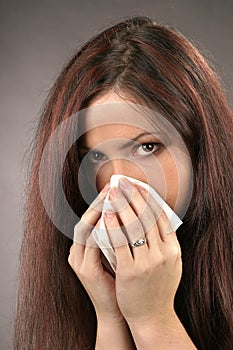 Woman wiping her nose