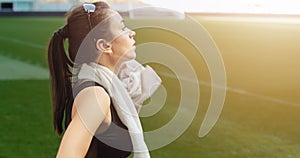 Woman Wiping Sweat on Stadium