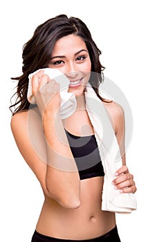 Woman wiping sweat with towel