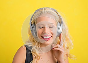 Woman with wireless headphones enjoying music