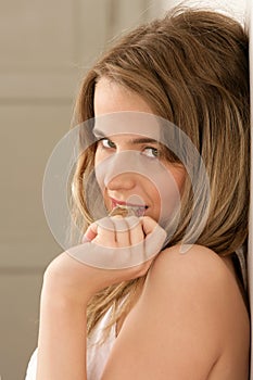 Woman with wisp in mouth photo